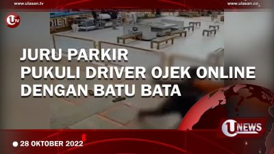 [Video] Juru Parkir Pukuli Driver Ojek Online dengan Batu